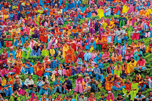 A large group of people wearing colourful clothing