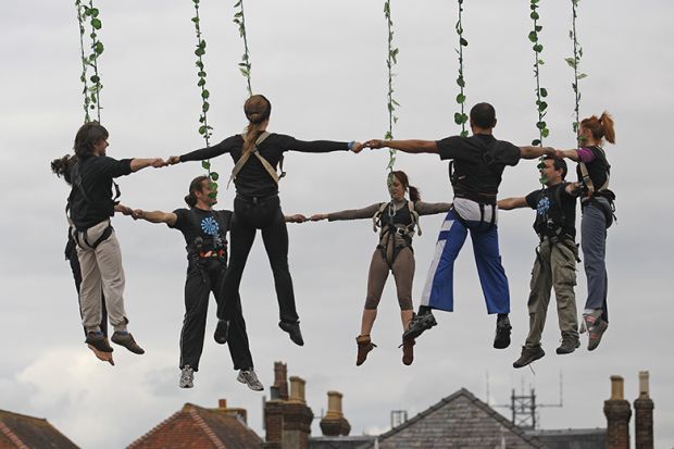 Aerial dancers holding hands, during a dress rehearsal ahead of their performance at the opening night of Salisbury International Arts Festival, England. To illustrate that institutions are increasingly grouping together locally in a bid to be heard. Aerial dancers holding hands, during a dress rehearsal ahead of their performance at the opening night of Salisbury International Arts Festival, England. To illustrate that institutions are increasingly grouping together locally in a bid to be heard.