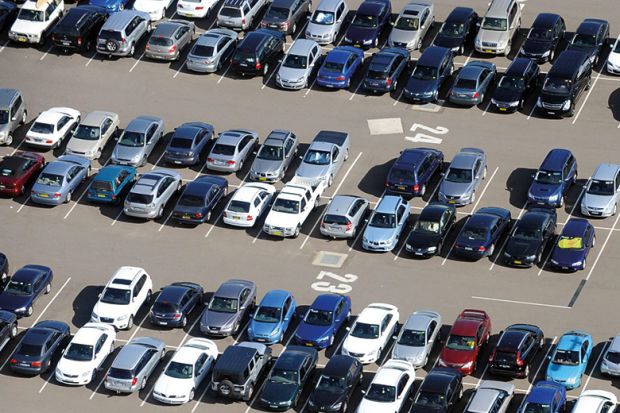 Aerial view of cars parked in airport long term parking Aerial view of cars parked in airport long term parking