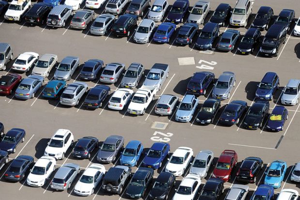Aerial view of cars parked in airport long term parking