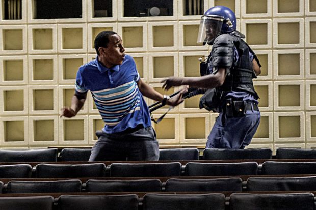 Anti-riot policeman reacts towards student protestor, University of the Witwatersrand