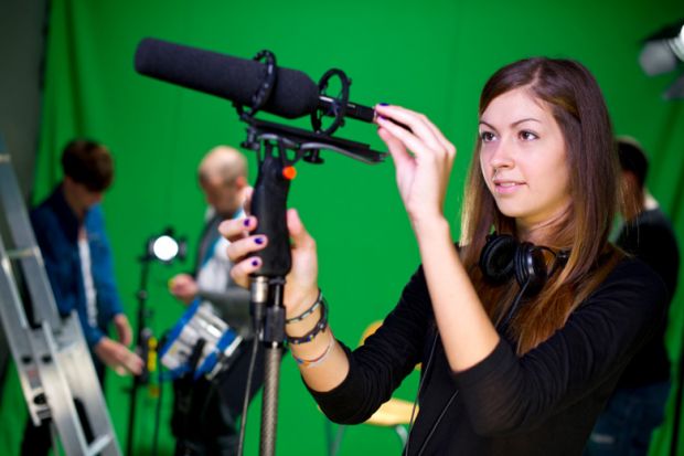 Apprentice journalist with microphone