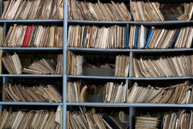 Archive of paperwork and files on shelves
