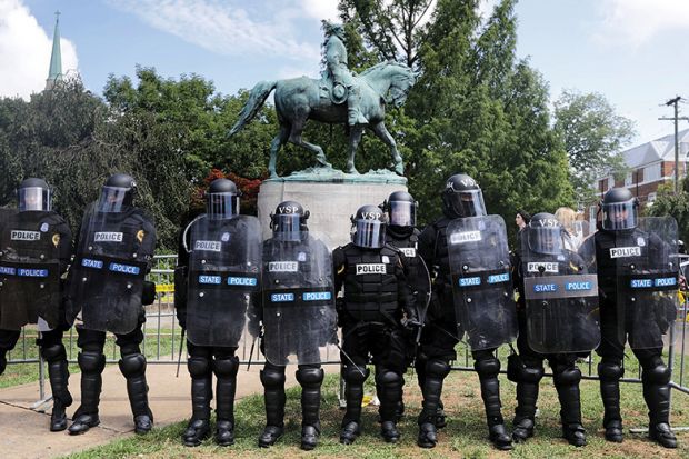 Armoured state police guarding statue