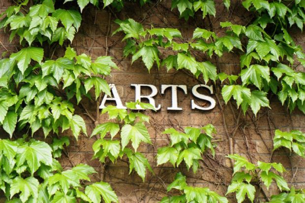 Arts Building sign covered in ivy
