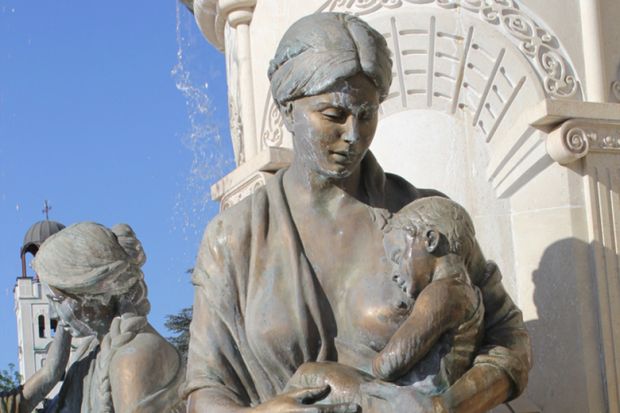Breastfeeding baby sculpture