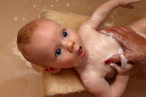 A baby being bathed