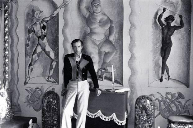 Cecil Beaton at home in 1934, with murals by Pavel Tchelitchew, Rex Whistler, Oliver Messel et al.