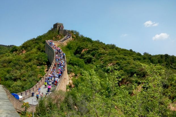 Beijing, China - July 25, 2019. People are climbing the Great Wall in China