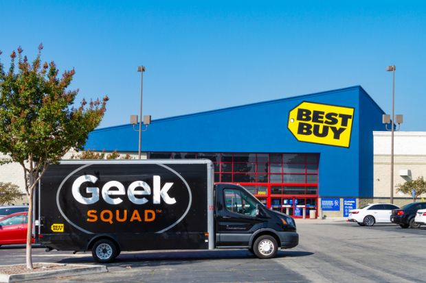 A large Geek Squad van is parked at the Best Buy retail store located in Montclair, California.