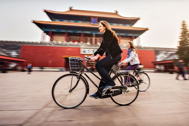 bike-past-asian-building