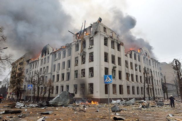 Firefighters work to contain a fire at the Economy Department building of Karazin Kharkiv National University, allegedly hit during recent shelling by Russia, on March 2, 2022