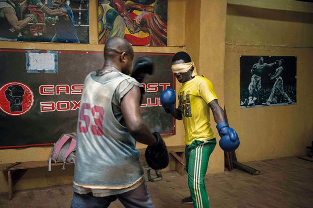 Boxers spar in gym, one of them blindfolded Boxers spar in gym, one of them blindfolded