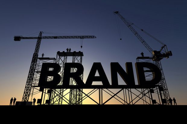 A giant sign reading "Brand" on scaffolding