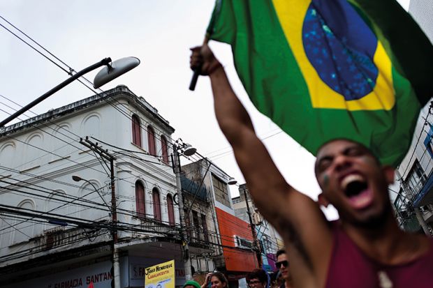 Man waves Brazilian flag