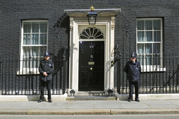 British police officers guarding 10 Downing Street entrance, London British police officers guarding 10 Downing Street entrance, London