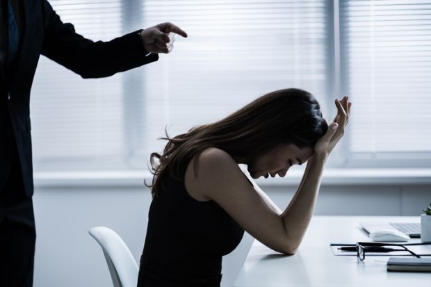 A boss bullies a female employee A boss bullies a female employee