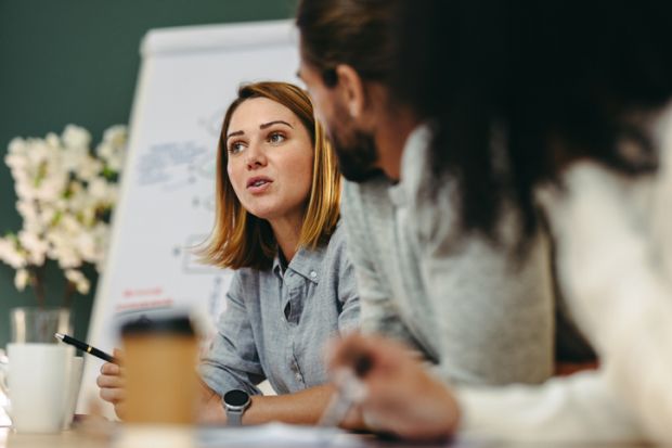 A woman at a business meeting, symbolising entrepreneurship A woman at a business meeting, symbolising entrepreneurship
