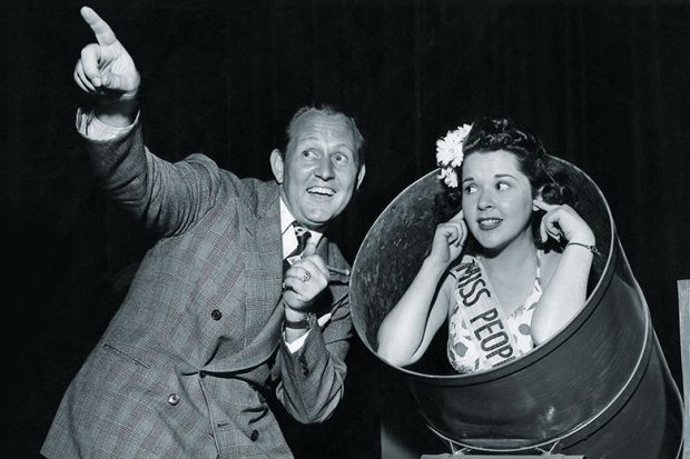 A woman about to be fired out of a cannon A woman about to be fired out of a cannon