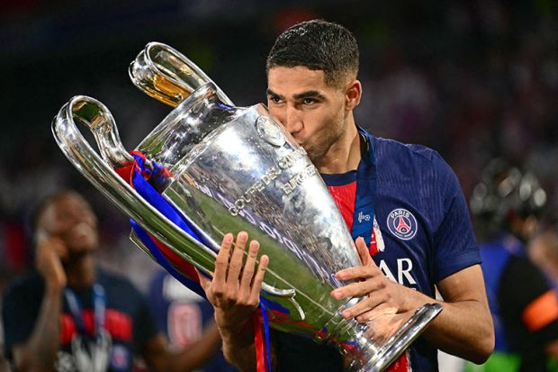 Paris Saint-Germain's defender Achraf Hakimi kisses the trophy after winning the UEFA Champions League final between Paris Saint-Germain (PSG) and Inter Milan on 31 May, 2025. To illustrate the ERC which is described as the 'Champions League' of research.