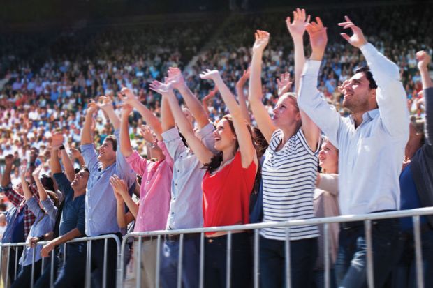 Cheering crowd in stadium
