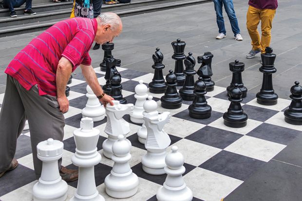 Man playing outdoor chess