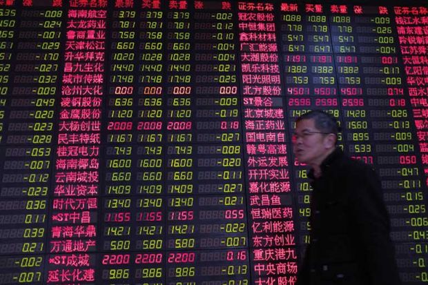 Chinese man by currency exchange board Chinese man by currency exchange board