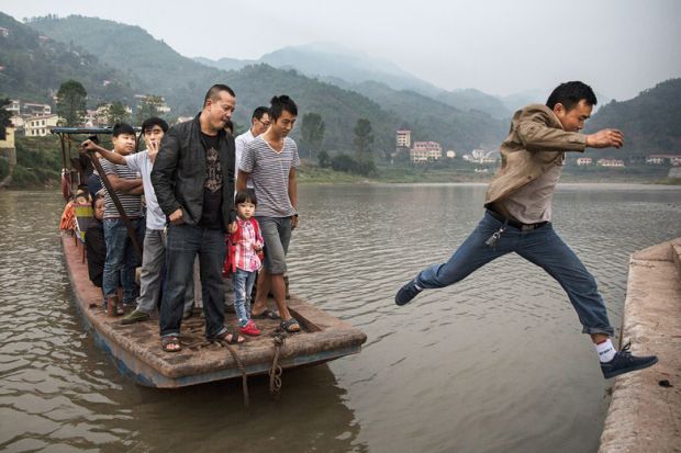 Man leaps from boat, China