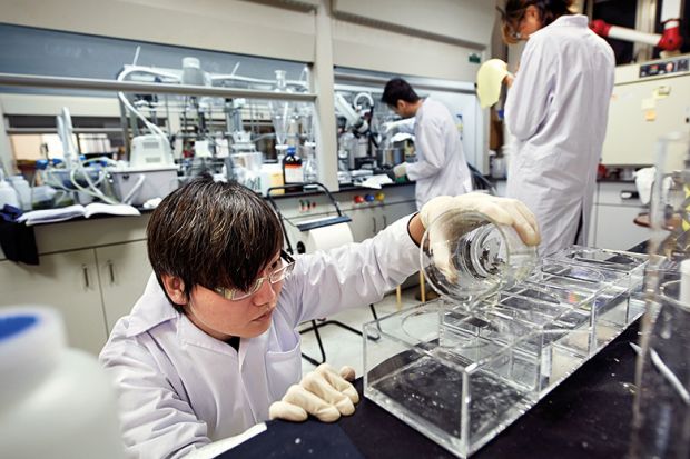 Chinese researchers working in laboratory