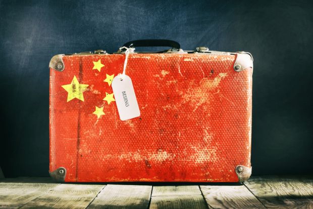 A suitcase with the Chinese flag on it illustrating opinion article on Chinese student flows to Western universities