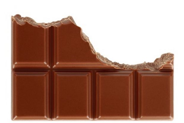 A half-eaten chocolate bar that looks like a declining graph, symbolising falling standards in HE