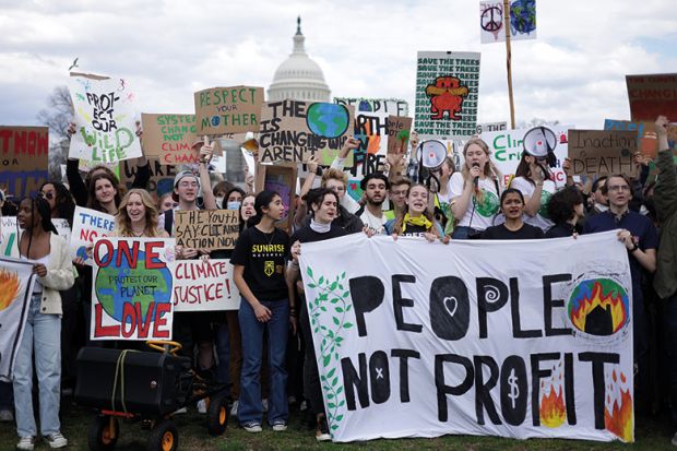 Environmental activists rally on Capitol Hill during a Fridays Global Climate Strike event in March 2022 in Washington, DC.