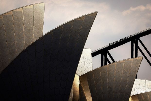 People climb the Sydney Harbour Bridge behind the Sydney Opera House, illustrating the soaring costs of educating Australian university students People climb the Sydney Harbour Bridge behind the Sydney Opera House, illustrating the soaring costs of educating Australian university students