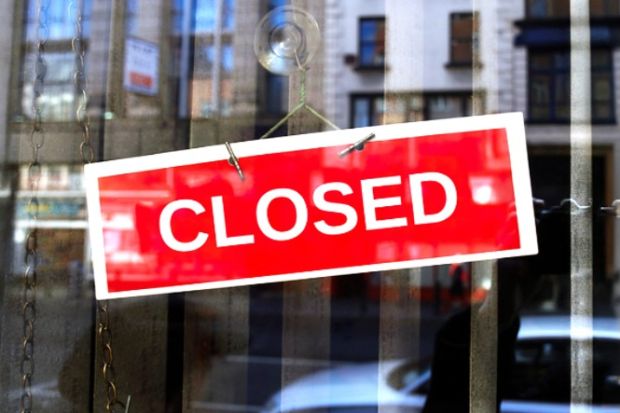 A closed sign on a door A closed sign on a door