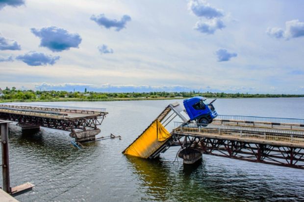 A collapsed bridge, representing failed grand challenges