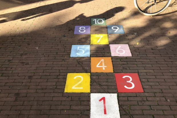 Colourful tiles in an Amsterdam sidewalk for playing hopscotch