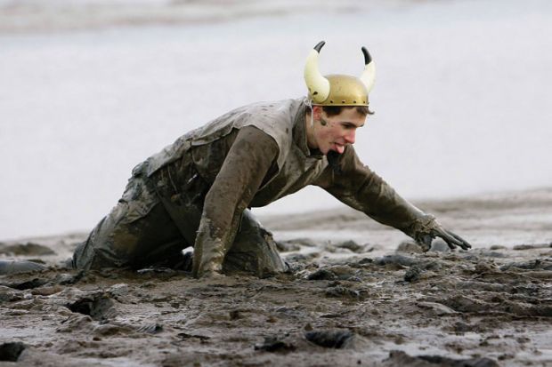 Competitor struggles during Maldon Mud Race, Essex