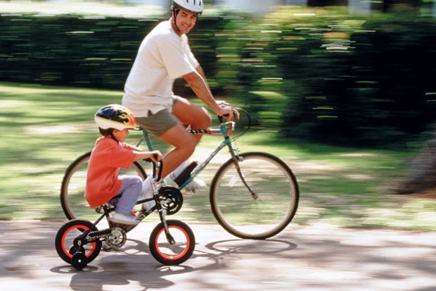 Father and son riding bicycles