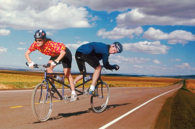 Couple struggling in opposite directions Couple struggling in opposite directions