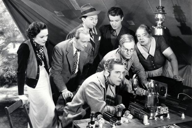 Crowd of people listening to-two way radio Crowd of people listening to-two way radio