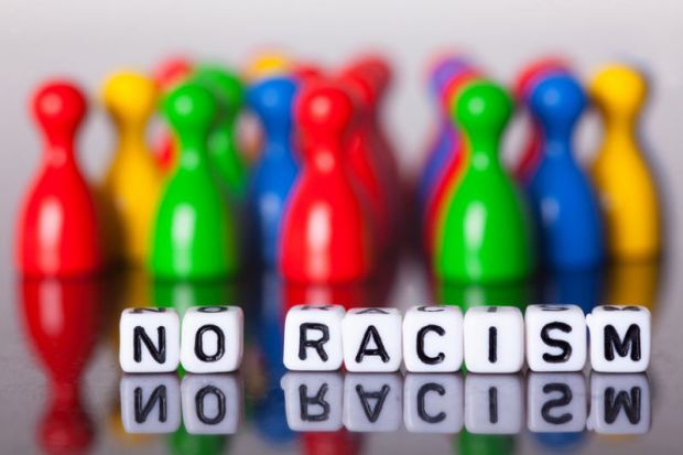 Cube letters show the words No Racism Cube letters show the words No Racism