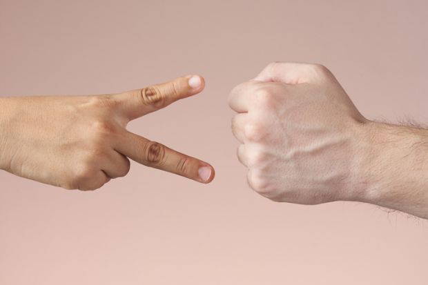 A fist and hands making a scissor shape, symbolising resisting cuts 