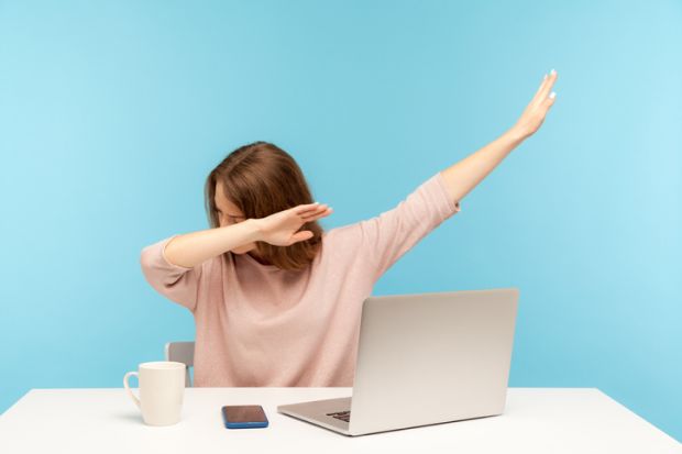 A woman watching a computer and doing a dab dance A woman watching a computer and doing a dab dance, symbolising online learning