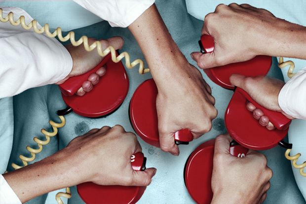 Several hands holding defibrillators on a chest. To illustrate that while there is a flow of extra medical graduates, the health system in the UK lacks the resources to boost training places or offer permanent jobs.