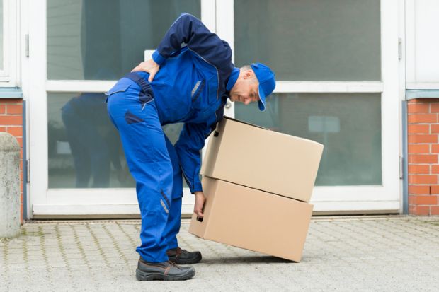 Delivery Man Suffering From Backpain While Lifting Boxes