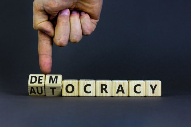 The word "democracy" turns into "autocracy"