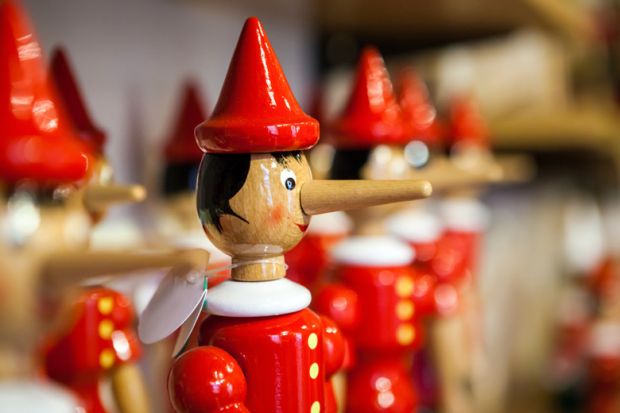 Display of Pinocchio puppets on shop shelf