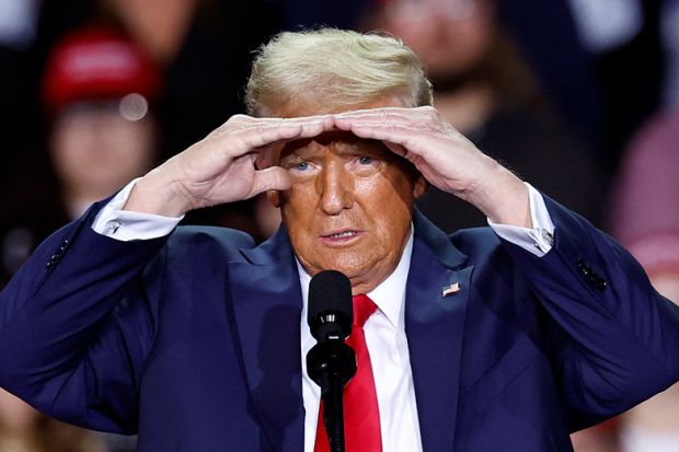 Donald Trump gestures as he speaks during a campaign rally at Van Andel Arena in Grand Rapids, Michigan on November 5, 2024. The UK higher education sector could benefit Trump's restrictive immigration policies. Donald Trump gestures as he speaks during a campaign rally at Van Andel Arena in Grand Rapids, Michigan on November 5, 2024. The UK higher education sector could benefit Trump's restrictive immigration policies.