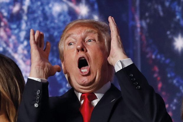 Donald Trump with his hands raised looking shocked