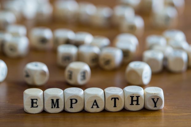 Dice spell out the word "empathy"